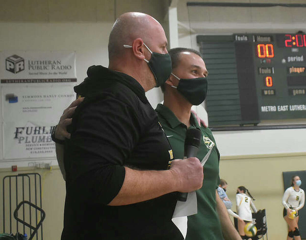 Metro-East Lutheran girls volleyball coach Jon Giordano, right, and athletic director Jason Batty joke around before the start of the match against Father McGivney on Monday.