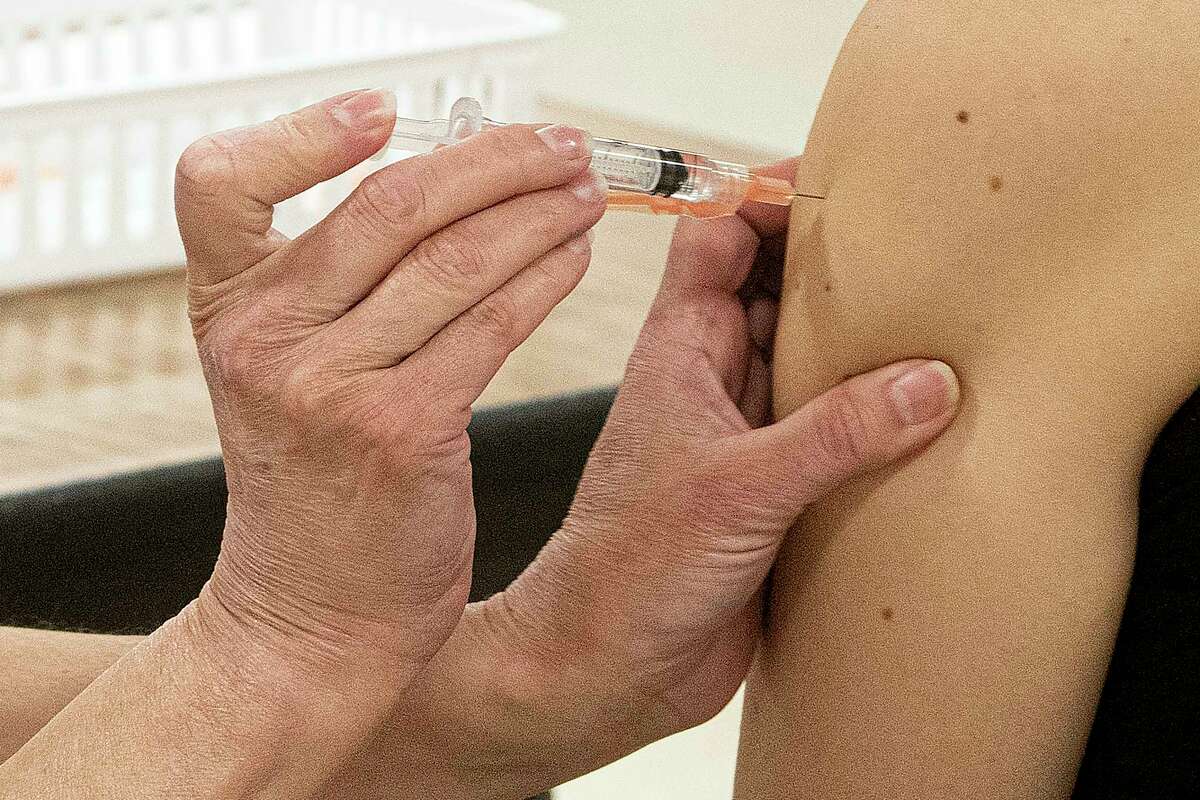 A person receives the Johnson & Johnson COVID-19 vaccine. (AP Photo/Phil Long, File)