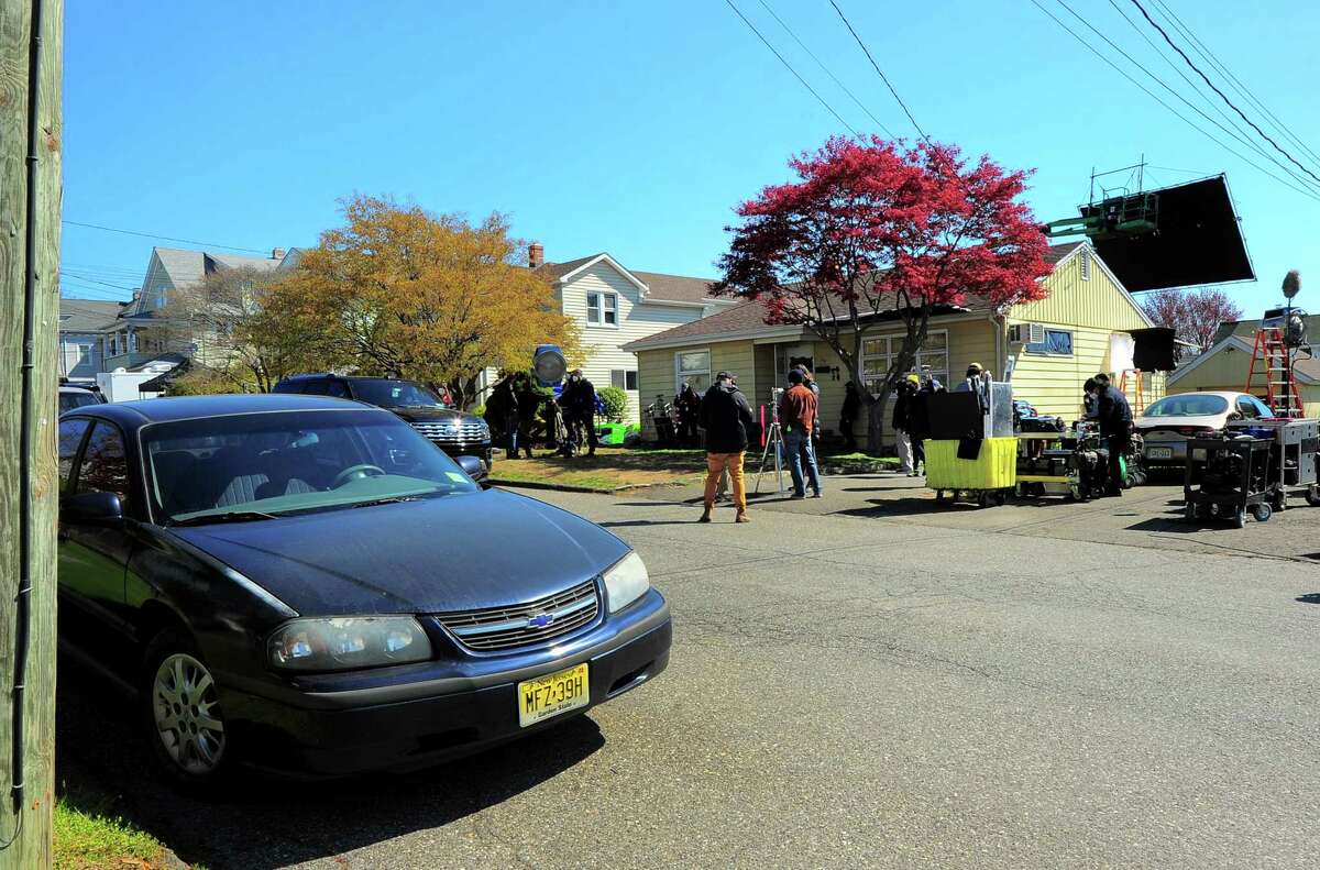 A home on Beal Street is used as a set for the upcoming Netfix movie The Good Nurse in Stamford, Conn., on Friday April 23, 2021. The vehicle parked at left is actually a set vehicle to match the state and era for the film which stars Jessica Chastain and Eddie Redmayne.