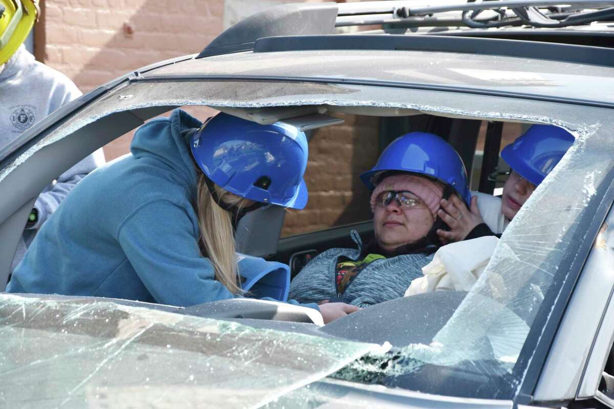 On Friday morning, West Shore Community College EMT students participated in a training scenario with the Manistee City Fire Department where a victim of a vehicle crash was trapped inside the vehicle and in need of medical attention. (Arielle Breen/News Advocate)
