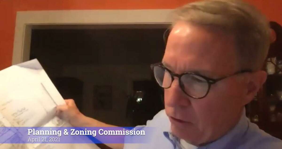 Acting Planning & Zoning Commission Chairman Tony Silber reviews site plans for a 10-house development on Huntington Turnpike at the commission's meeting on April 21, 2021.