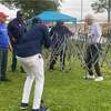 Candidates - those who saw damage and those who were spared - worked together Friday to repair vandalism done to Black candidates' campaign setups.