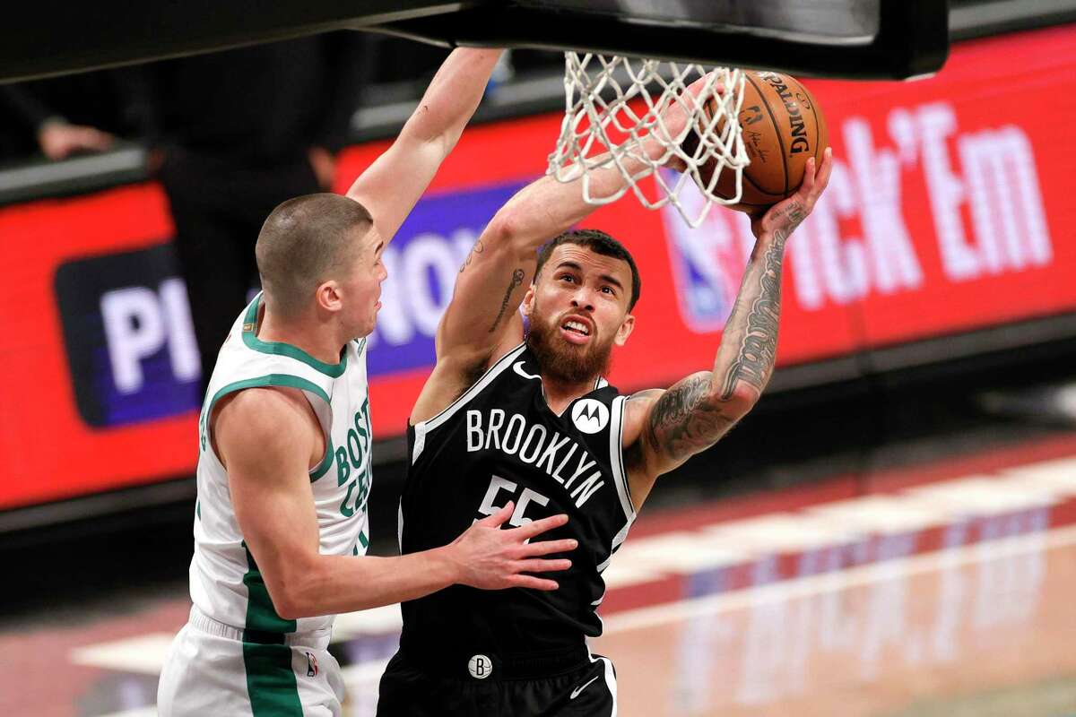NEW YORK, NEW YORK - APRIL 23: Mike James #55 of the Brooklyn Nets goes to the basket as Payton Pritchard #11 of the Boston Celtics defends during the second half at Barclays Center on April 23, 2021 in the Brooklyn borough of New York City. The Nets won 109-104. NOTE TO USER: User expressly acknowledges and agrees that, by downloading and or using this photograph, User is consenting to the terms and conditions of the Getty Images License Agreement. (Photo by Sarah Stier/Getty Images)