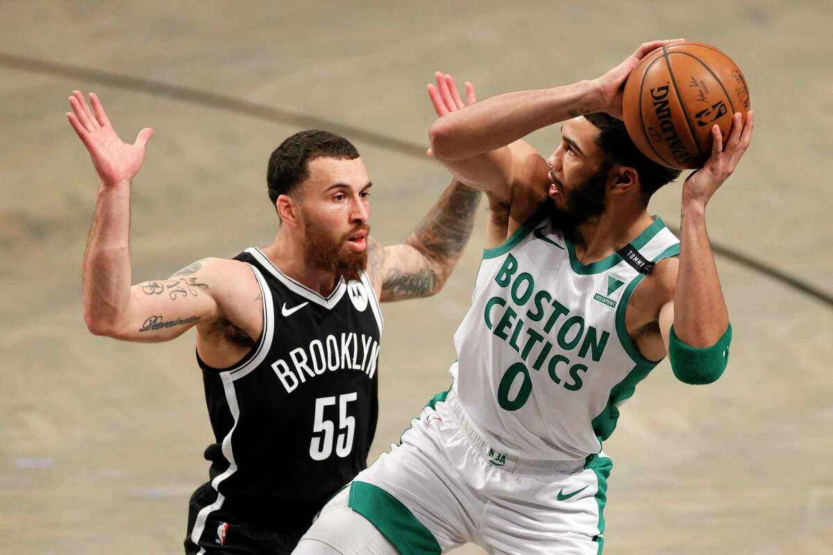 NEW YORK, NEW YORK - APRIL 23: Jayson Tatum #0 of the Boston Celtics looks to pass as Mike James #55 of the Brooklyn Nets defends during the first half at Barclays Center on April 23, 2021 in the Brooklyn borough of New York City. NOTE TO USER: User expressly acknowledges and agrees that, by downloading and or using this photograph, User is consenting to the terms and conditions of the Getty Images License Agreement. (Photo by Sarah Stier/Getty Images)