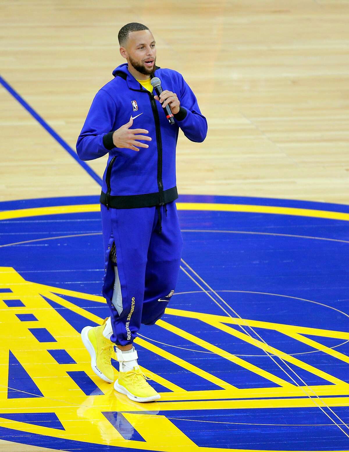 Stephen Curry (30) addresses the fans after they returned to Chase Center for the first time in 409 games before the Golden State Warriors played the Denver Nuggets in San Francisco, Calif., on Friday, April 23, 2021.