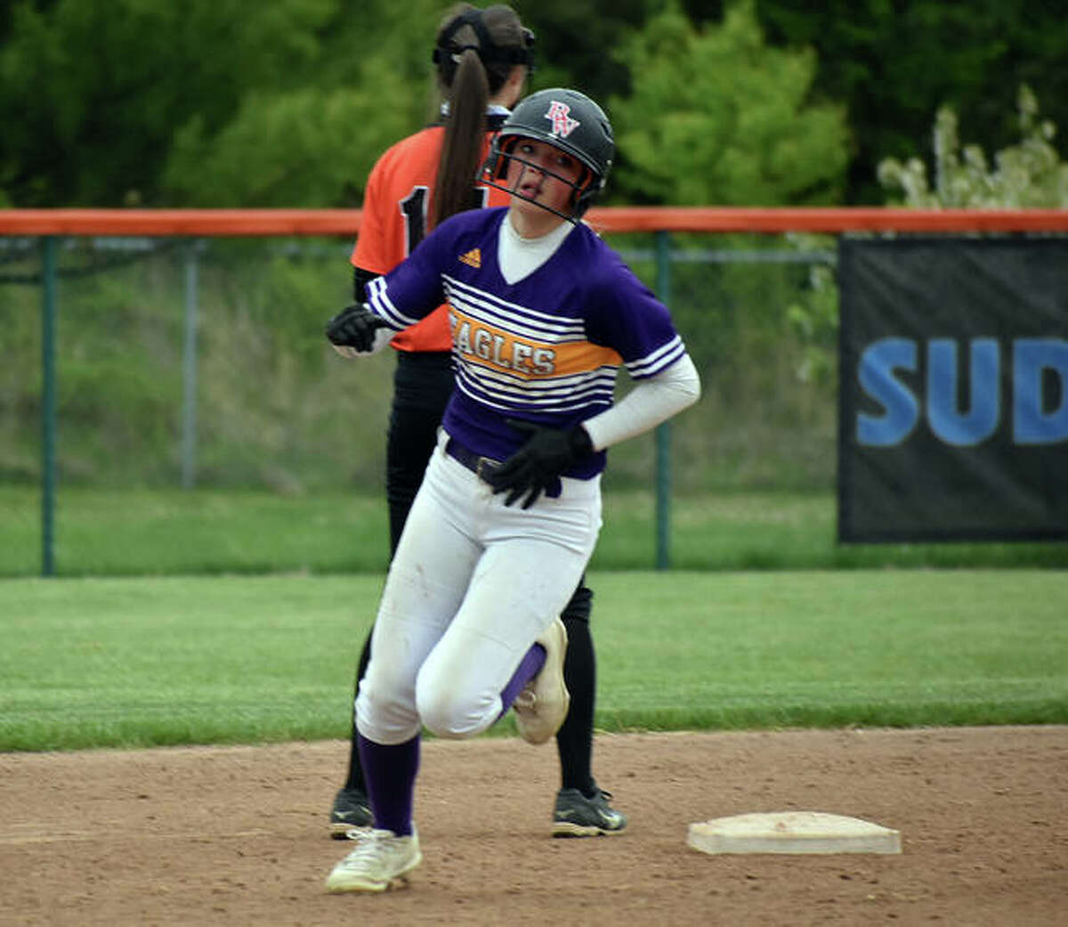 CM’s Kelbie Zupan rounds second on her way to third for a triple against Edwardsville on Friday at the District 7 Sports Complex in Edwardsville.