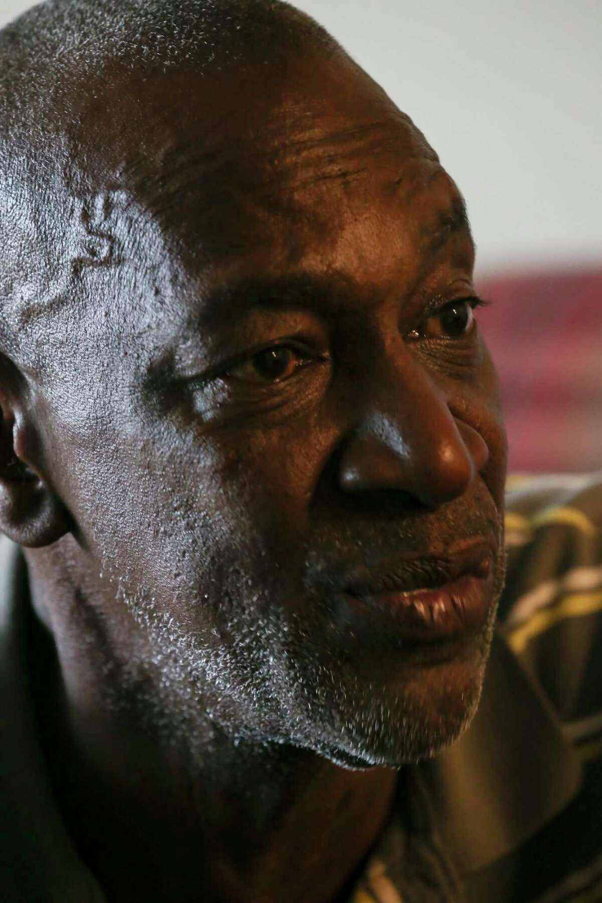Larry McCoy, 57, reflects on his life during an interview at his apartment, Friday, April 23, 2021. McCoy, a nine-year Air Force veteran who served in Desert Storm, was homeless, not for the first time, when he was kicked out of a previous apartment in July 2019. Suffering from depression and schizophrenia, he was able to rent the apartment with help from the Veteran Affairs Supportive Housing Voucher program. He moved into the apartment in August 2019.