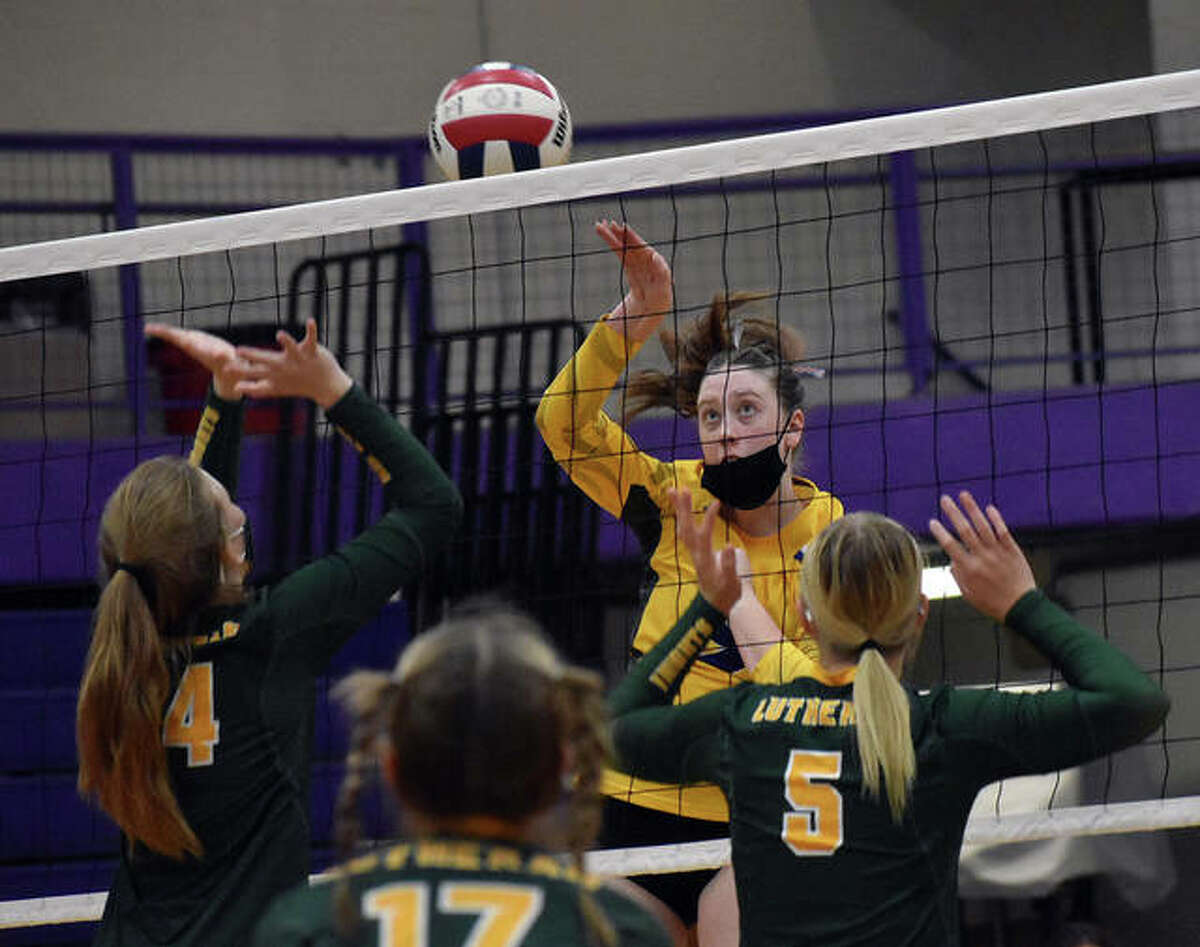 CM’s Lauren Dunlap hammers down a kill in the second game against Metro-East Lutheran on Friday in Bethalto.