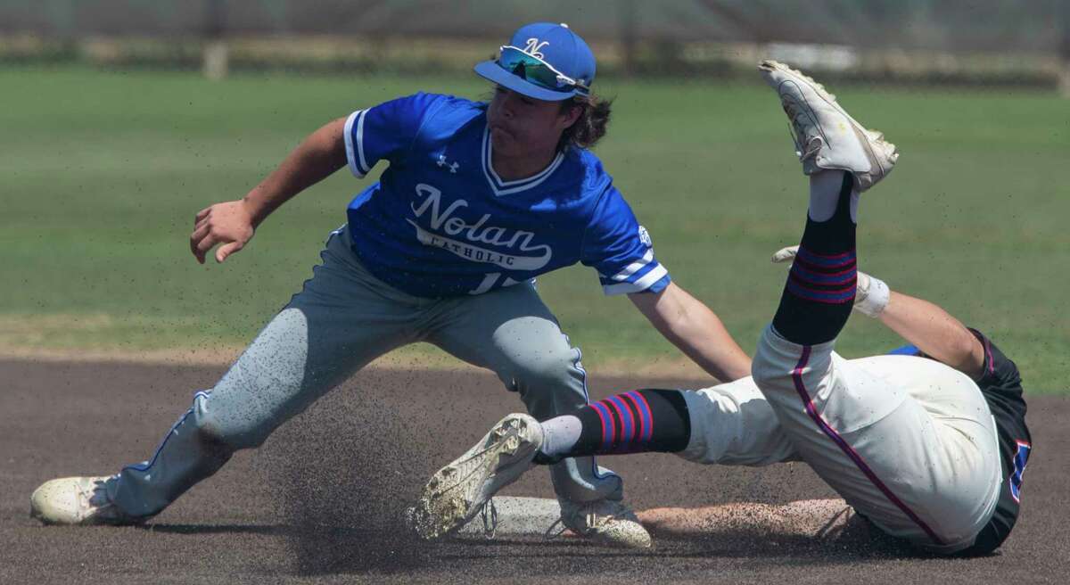 FW Nolan Catholic's Devon Ashcraft makes the tag for an out as Midland Christian's Luke Greenlee tries to steal second and slide around the tag 04/24/2021 at Christensen Stadium. Tim Fischer/Reporter-Telegram