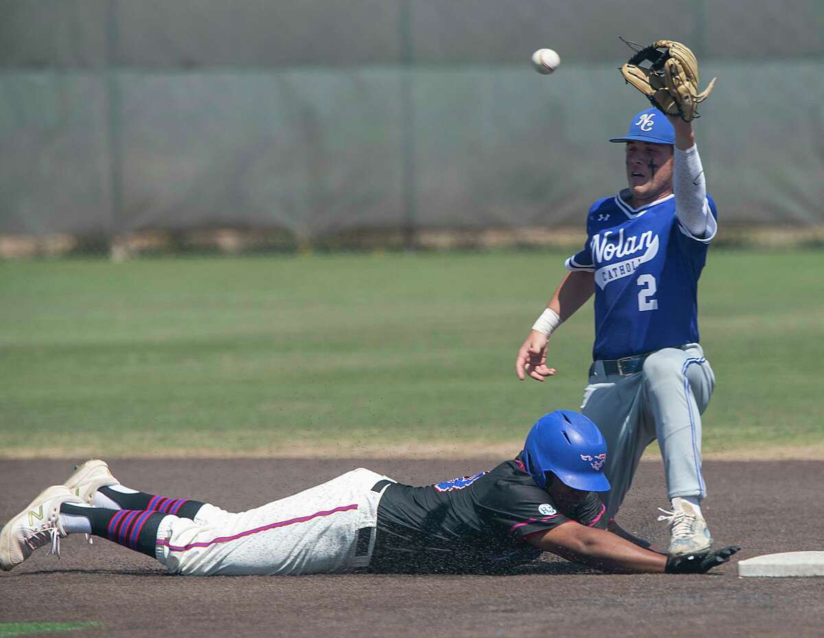 Midland Christian's Jacob Hicks gets his hand stepped on as he safely dives back to second as FW Nolan Catholic's Blake LaLonde looks to make a tag on a pickoff attempt 04/24/2021 at Christensen Stadium. Tim Fischer/Reporter-Telegram