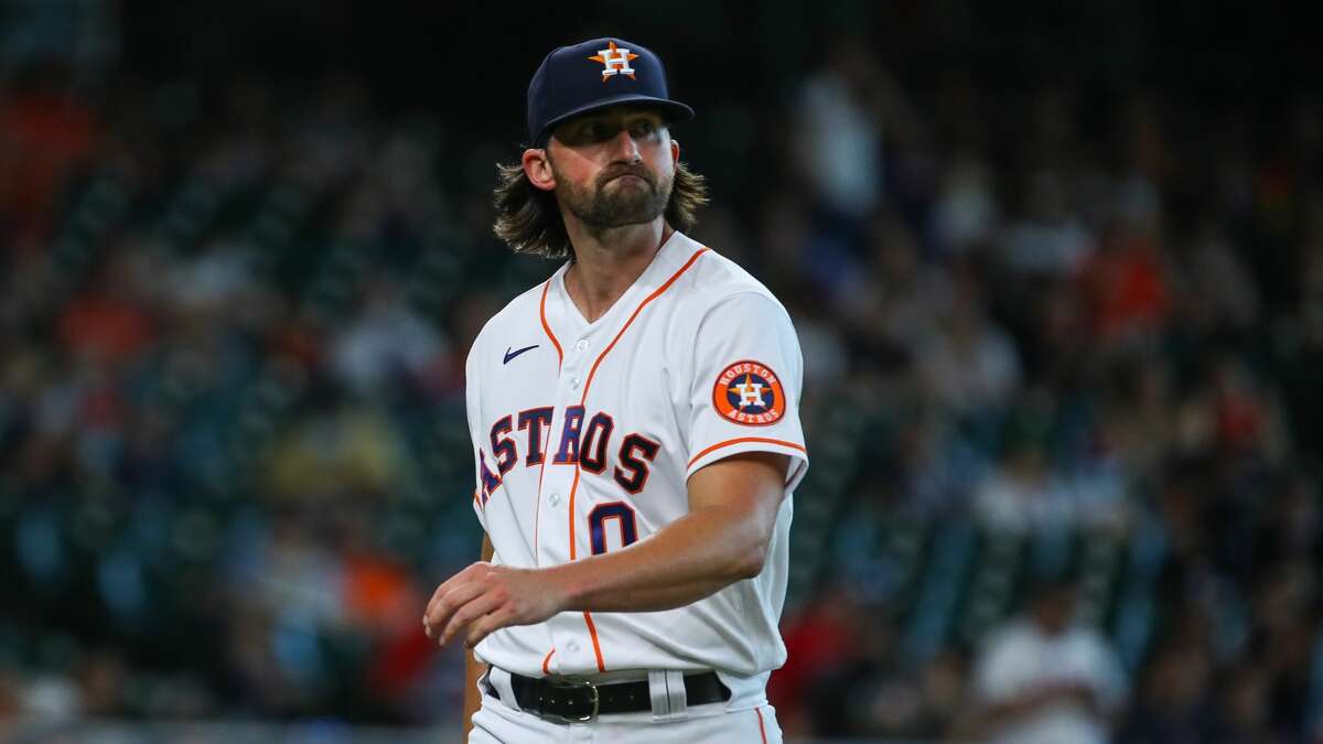 Houston Astros relief pitcher Kent Emanuel (0) walks to the dugout at the end of the eighth inning of an MLB game against the Los Angeles Angels at Minute Maid Park on Saturday, April 24, 2021, in Houston.