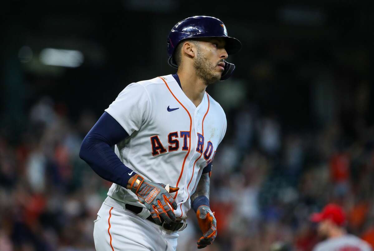 Houston Astros shortstop Carlos Correa (1) rounds the bases after hitting a solo home run against the Los Angeles Angels during the first inning of an MLB game at Minute Maid Park on Saturday, April 24, 2021, in Houston.