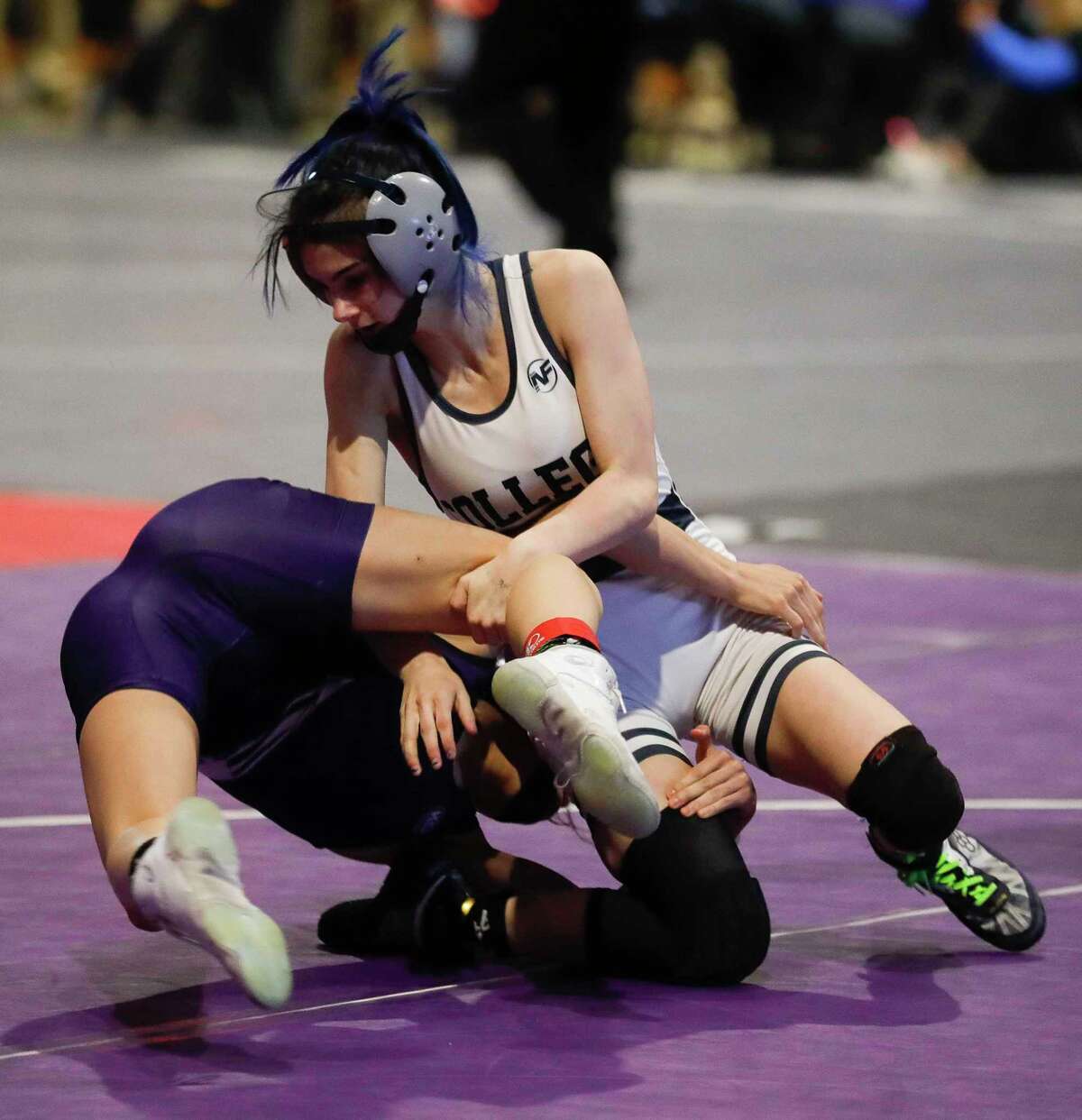 Olivia DeGeorgio of College Park competes against Rachel Cotter of Katy Morton Ranch in the Class 6A girls 95-pound championship during the UIL State Wrestling Championships, Saturday, April 24, 2021, in Cypress.