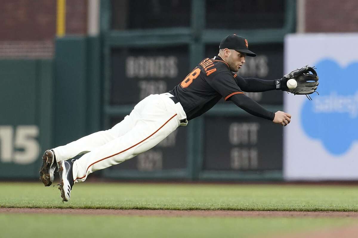 San Francisco Giants second baseman Tommy La Stella fields a ground out hit by Miami Marlins' Jesus Aguilar during the fourth inning of a baseball game in San Francisco, Saturday, April 24, 2021. (AP Photo/Jeff Chiu)