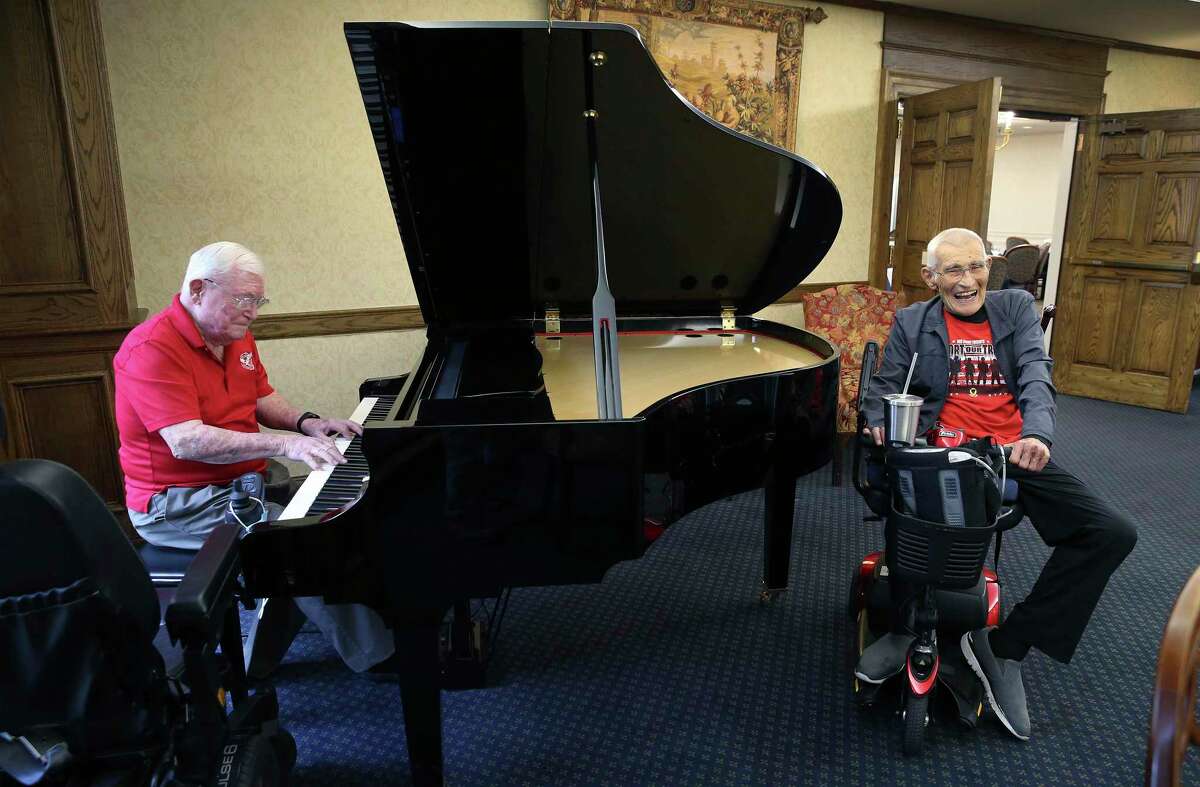 Army retired Lt. Gen. Quinn Becker (right) smiles as Army retired Maj. Gen. William L. Moore plays the piano. The two generals not only share a kindred spirit of military service but they also are friends who reside at the Army Residence Community on the city's Northeast Side. Moore is a skilled piano player and Becker is an avid photographer. The two generals also share a rapport much like brothers.