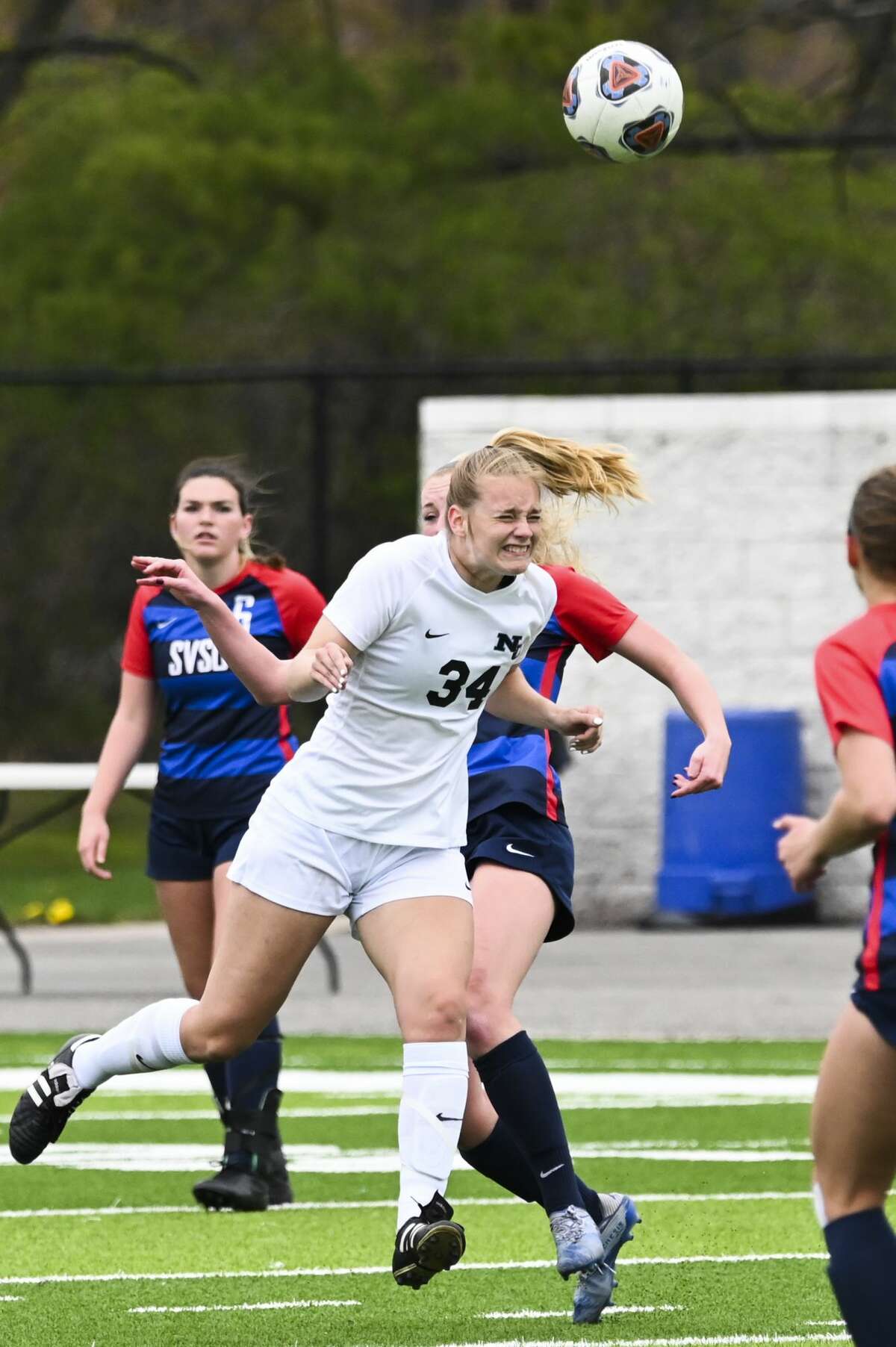 Northwood University's Katie Foster jumps up for a header during the Timberwolves' game against Saginaw Valley State University Saturday, April 24, 2021 at Northwood. (Adam Ferman/for the Daily News)