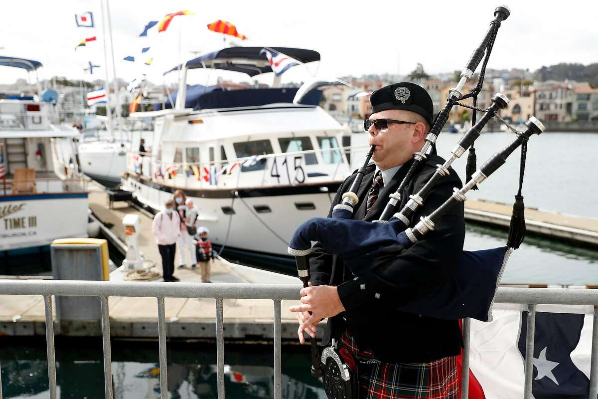 Steven McElhaney of the Prince Charles Pipe Band in South San Francisco plays the bagpipes on opening day of sailing season at St. Francis Yacht Club in San Francisco on Sunday.