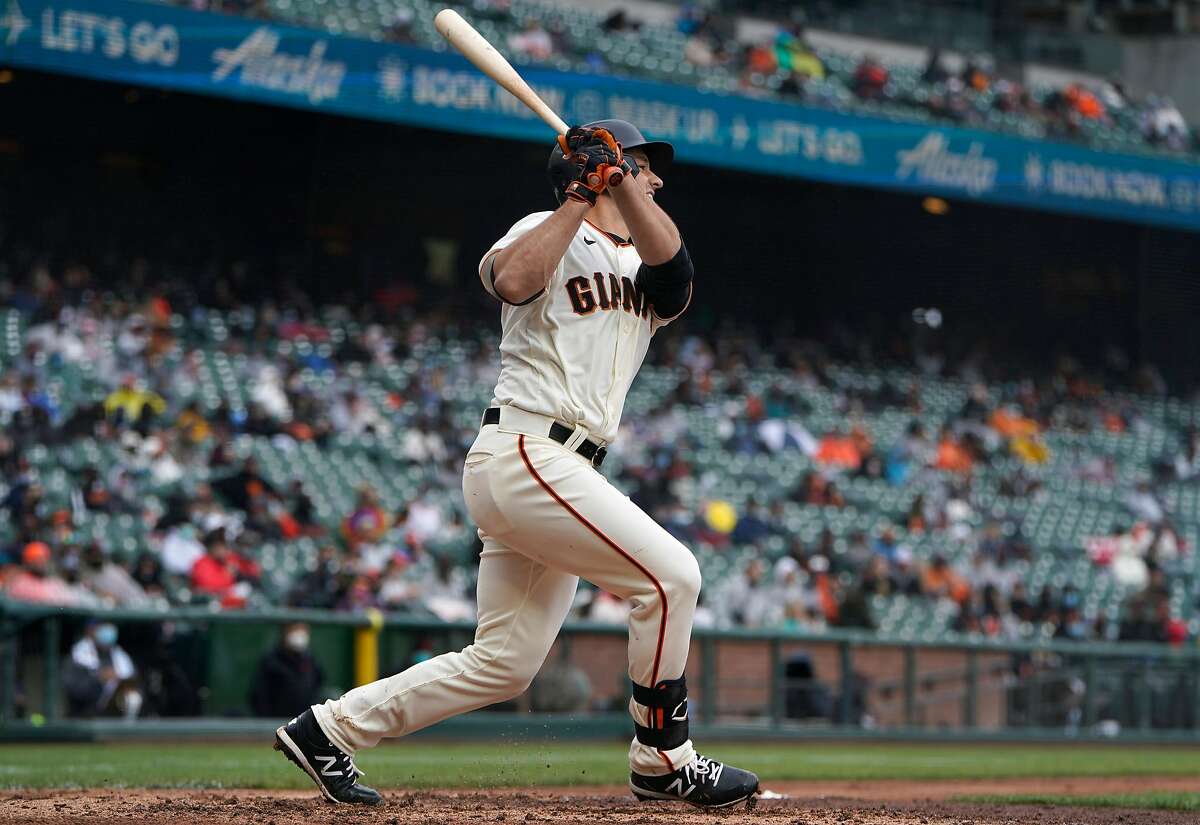 The Giants’ Jason Vosler watches his first career hit, a single, in the fifth inning of Sunday’s game against the Marlins.