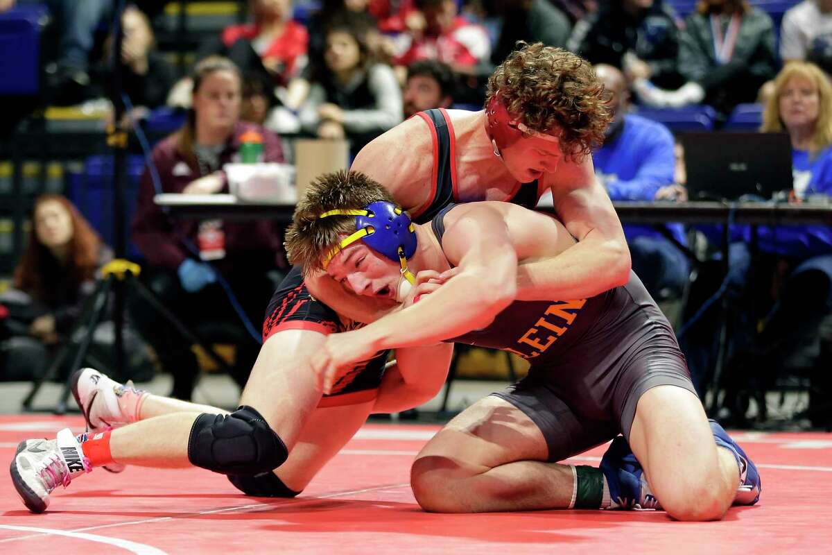 Klein’s Eli Sheeren, bottom, and Euless Trinity’s Cameron Bye, top, during their Boys 6A-182lbs championship match of the state high school wrestling championships Saturday, Feb. 22, 2020 at the Berry Center in Cypress, TX.