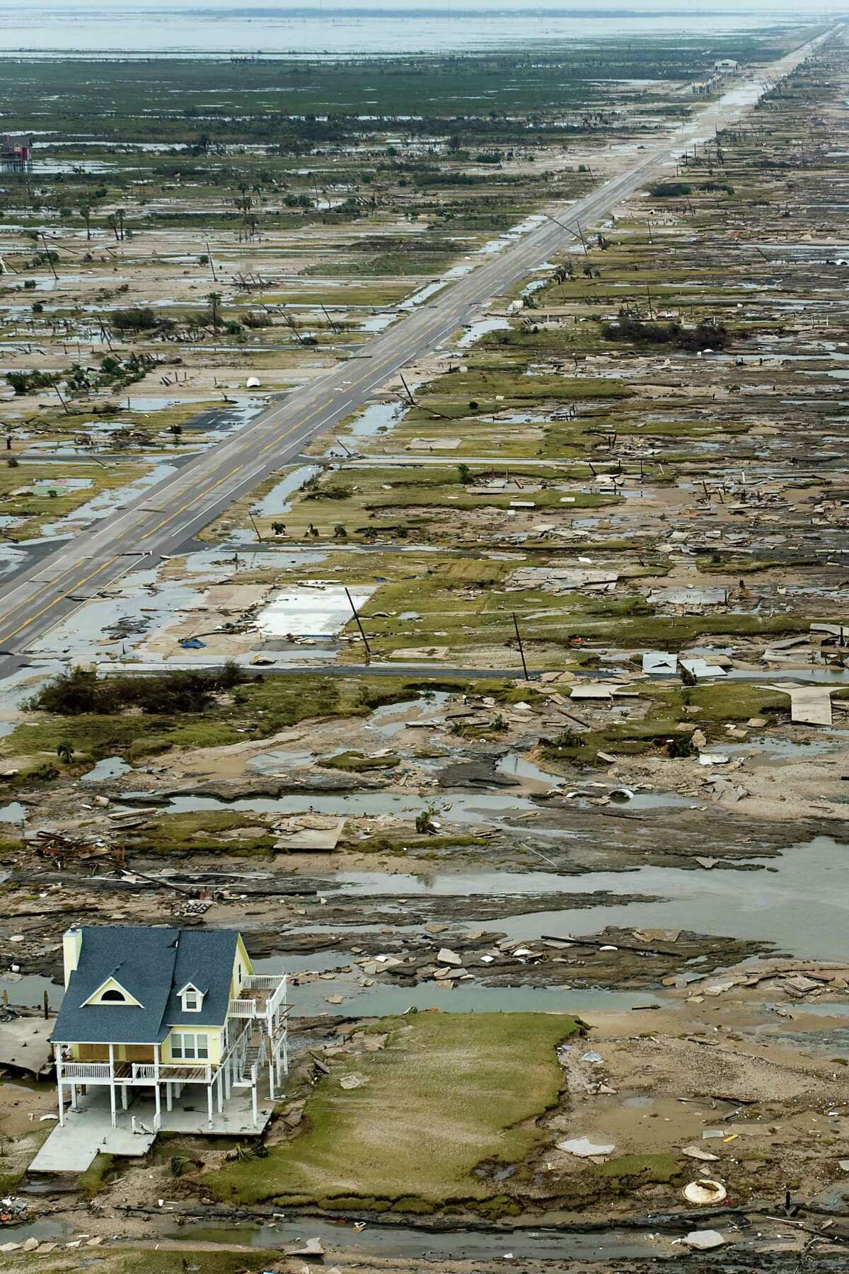 A single house is left standing amidst the devastation left by Hurricane Ike, Sunday, Sept. 14, 2008, in Gilchrist, Texas. ( Smiley N. Pool / Chronicle ) Warren and Pam Adams house is left standing amidst the devastation left by Hurricane Ike in Gilchrist.