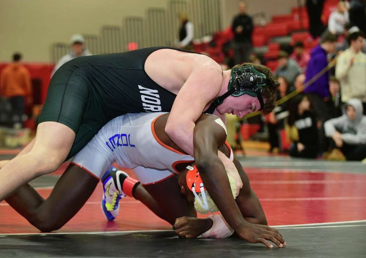 Brendan Gilchrist of Norwalk High School wrestles Tyrell Jones of Danbury in the 182 lbs. bout during the FCIAC wrestling championships Saturday, February 15, 2020, at New Canaan High School in New Canaan, Conn.