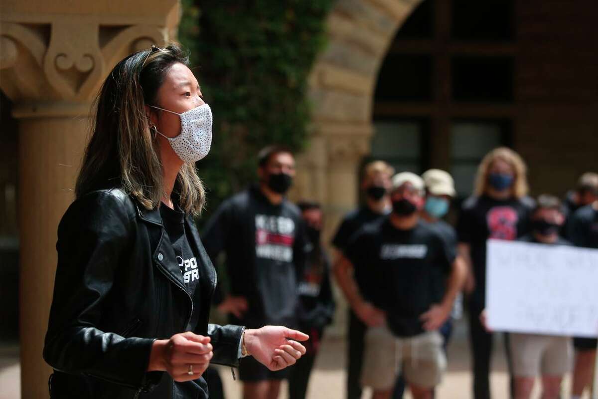 Freshman Mikayla Chen, a member of the lightweight rowing team, speaks in April at a protest of Stanford University’s decision to cut 11 varsity sports.