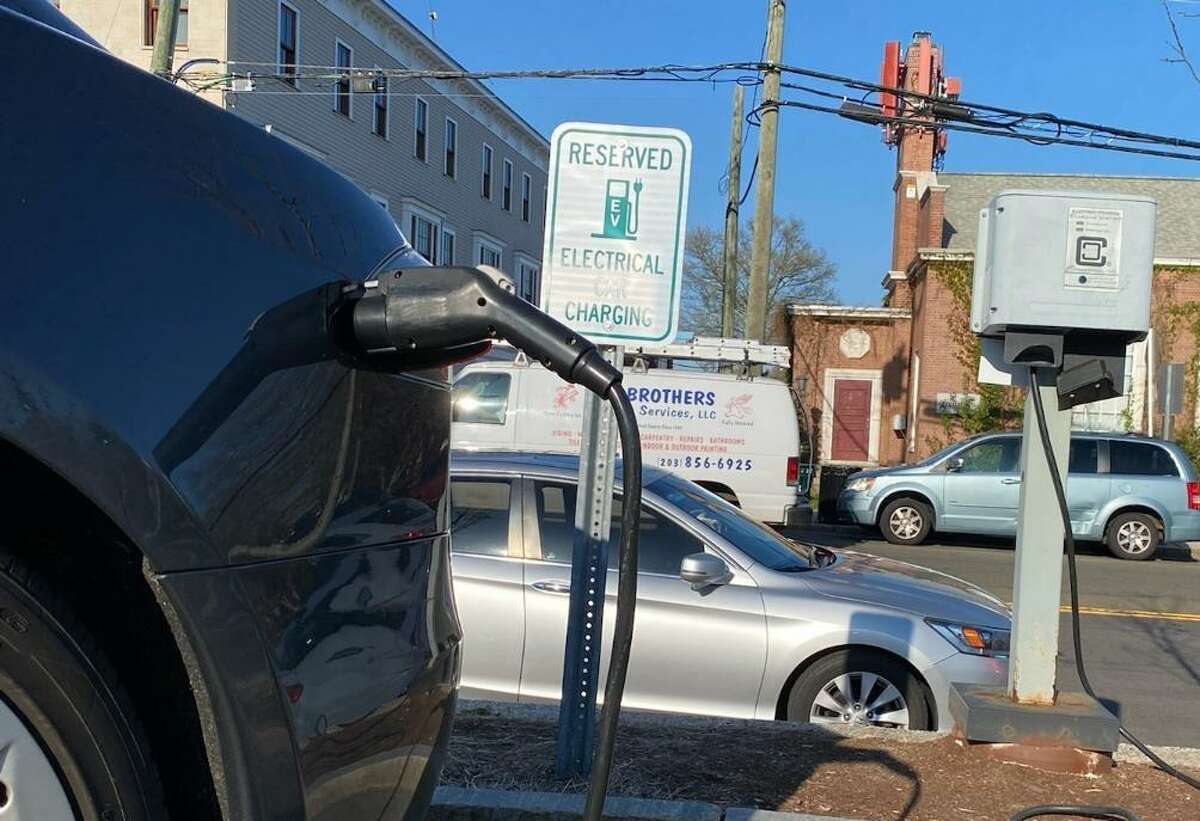 New Canaan has one municipal charger for electric vehicles located in Morse Court parking lot. Soon the town may be getting more installed.  Picture was taken April 2021.