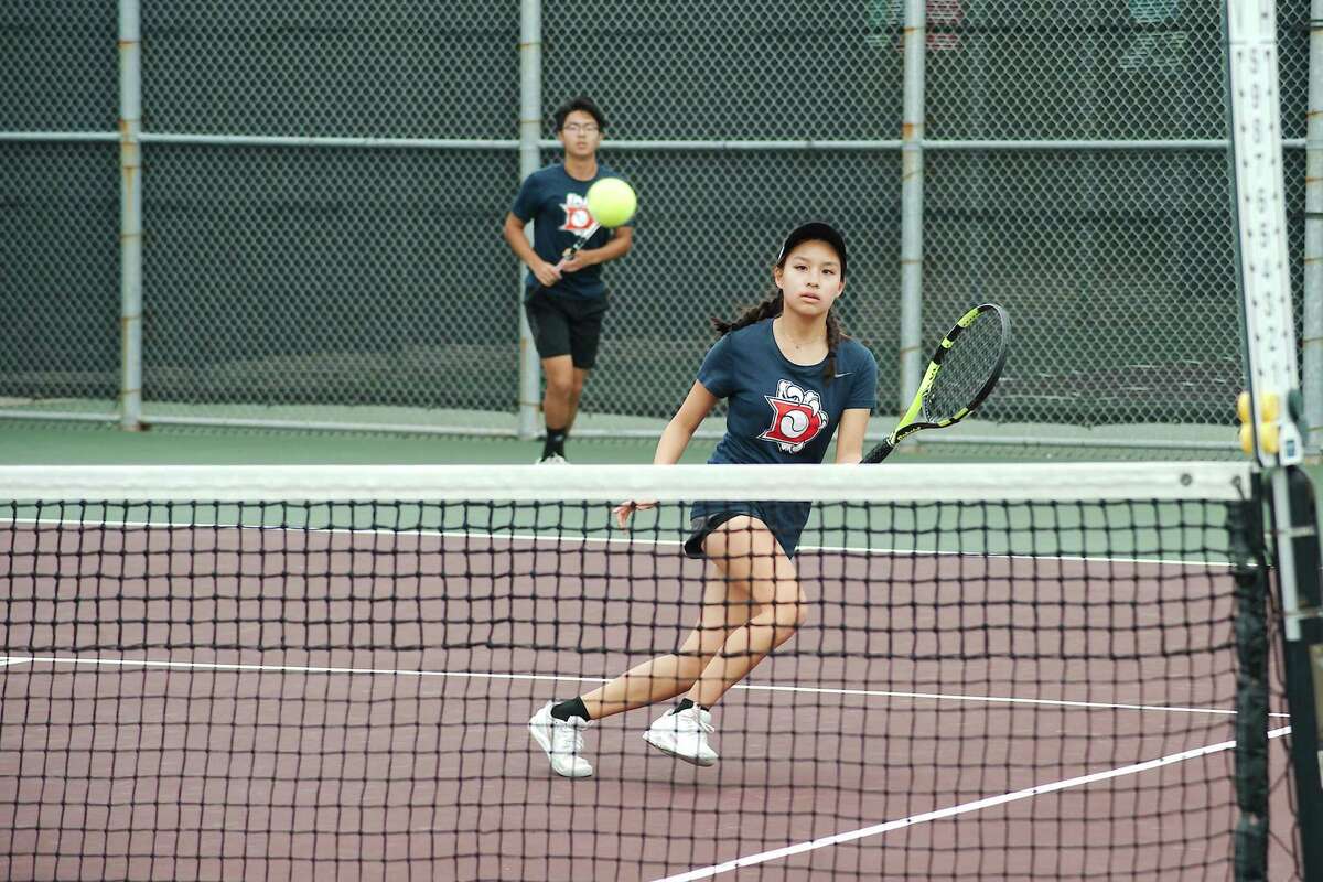 Dawson's Andy Jiang and Gracie Nguyen compete in mixed doubles in the Region 3-6A tennis tournament Tuesday in Deer Park.