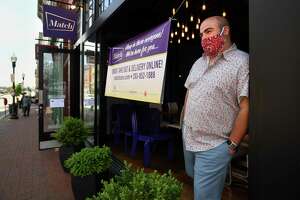 Match restaurant owner and chef Matt Storch waits to meet with Norwalk Mayor Harry Rilling and Lt. Governor Susan Bysiewicz during a walking tour of the Washington Street retail and restaurant district in Norwalk, Conn. on Wednesday, May 27, 2020.