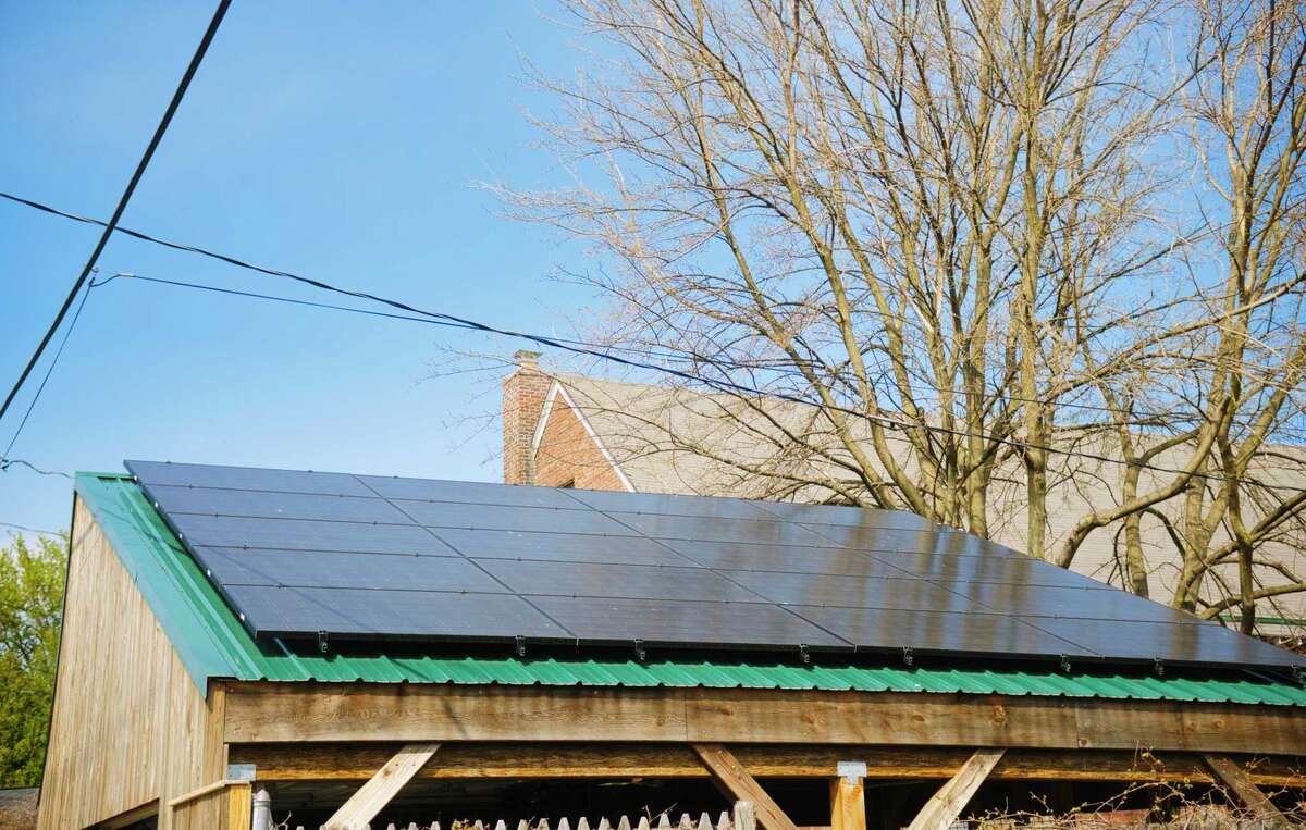 A view of solar panels on the carport that Diane Bell and her husband Don Bell had built, seen here on Tuesday, April 27, 2021, in Troy, N.Y. The carport's design and shape was picked to give maximum exposure to the solar panels on the roof of the carport. (Paul Buckowski/Times Union)