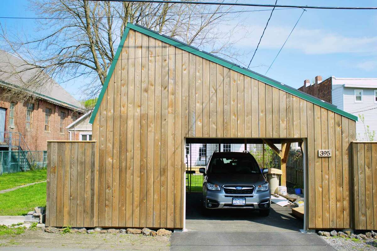 A view of the carport that Diane Bell and her husband Don Bell had built, seen here on Tuesday, April 27, 2021, in Troy, N.Y. The carport's design and shape was picked to give maximum exposure to the solar panels on the roof of the carport. The panels are located on the longer section of the roof. (Paul Buckowski/Times Union)