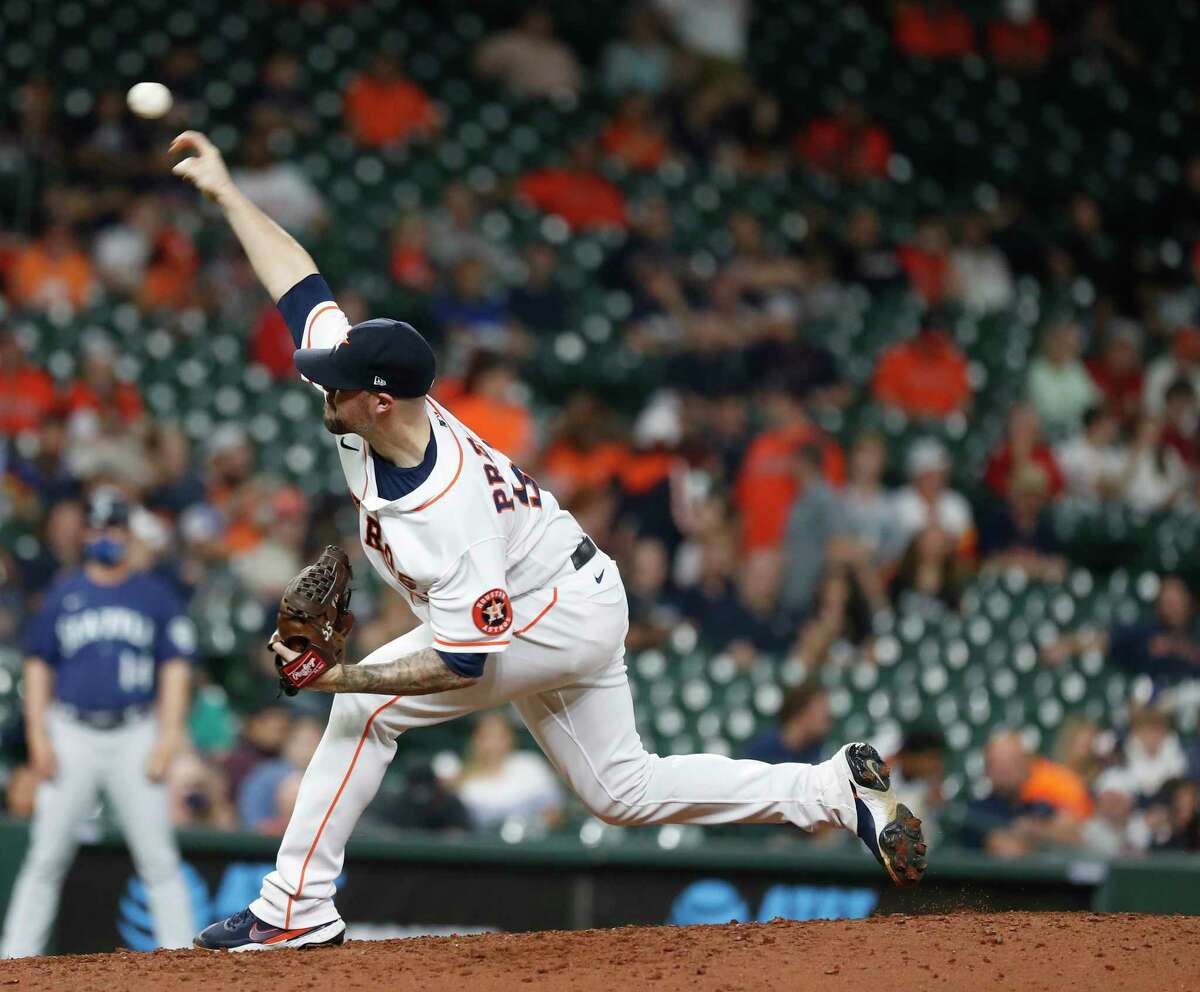 Houston Astros relief pitcher Ryan Pressly (55) pitches during the ninth inning of an MLB baseball game at Minute Maid Park, Tuesday, April 27, 2021, in Houston.