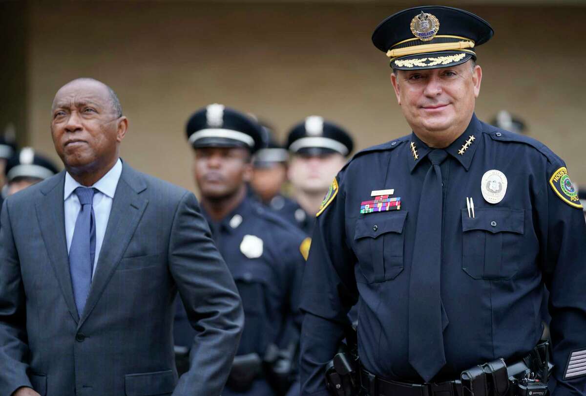 Houston Mayor Sylvester Turner, left, and Houston Police Chief Art Acevedo, shown here March 11. City Council on Wednesday hired an outside law firm to defend the city and Acevedo in a civil rights lawsuit filed by family of two people killed in the botched Harding Street raid Jan. right, take a group photo with the Houston Police Dept. Cadet Class 247 before the graduation ceremony for held at Houston Police Academy L.D. Morrison, Sr. Memorial Center at 17000 Aldine-Westfield Road, Thursday, March 11, 2021 in Houston.