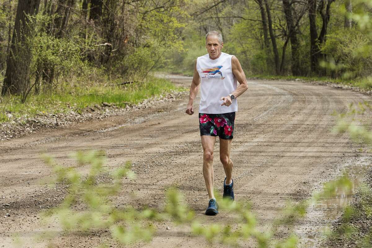 Bill Leibfritz of Midland runs along the Tittabawassee River during his daily run Wednesday, April 28, 2021 in Midland. Bill has gone running every day for the past 39 years. (Katy Kildee/kkildee@mdn.net)