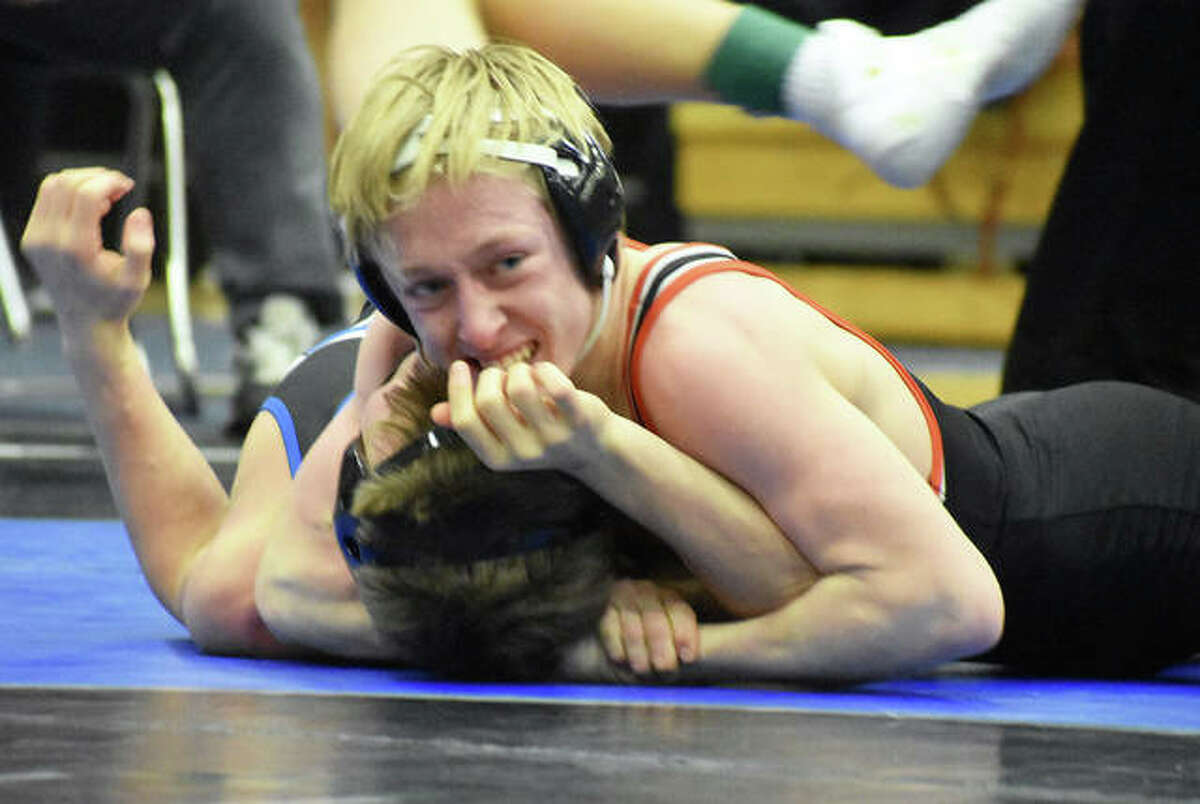Edwardsville’s Dylan Gvillo looks to the official for a pin call during his consolation semifinal match at 126 pounds in the Class 3A Quincy Sectional.