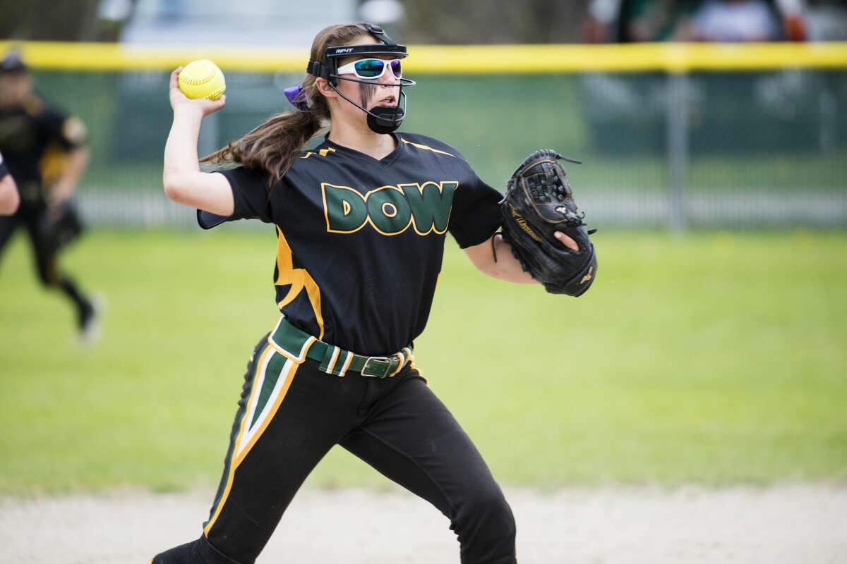 Dow High's Taylor Huschke throws the ball to first during a May 16, 2019 game against Midland High. 