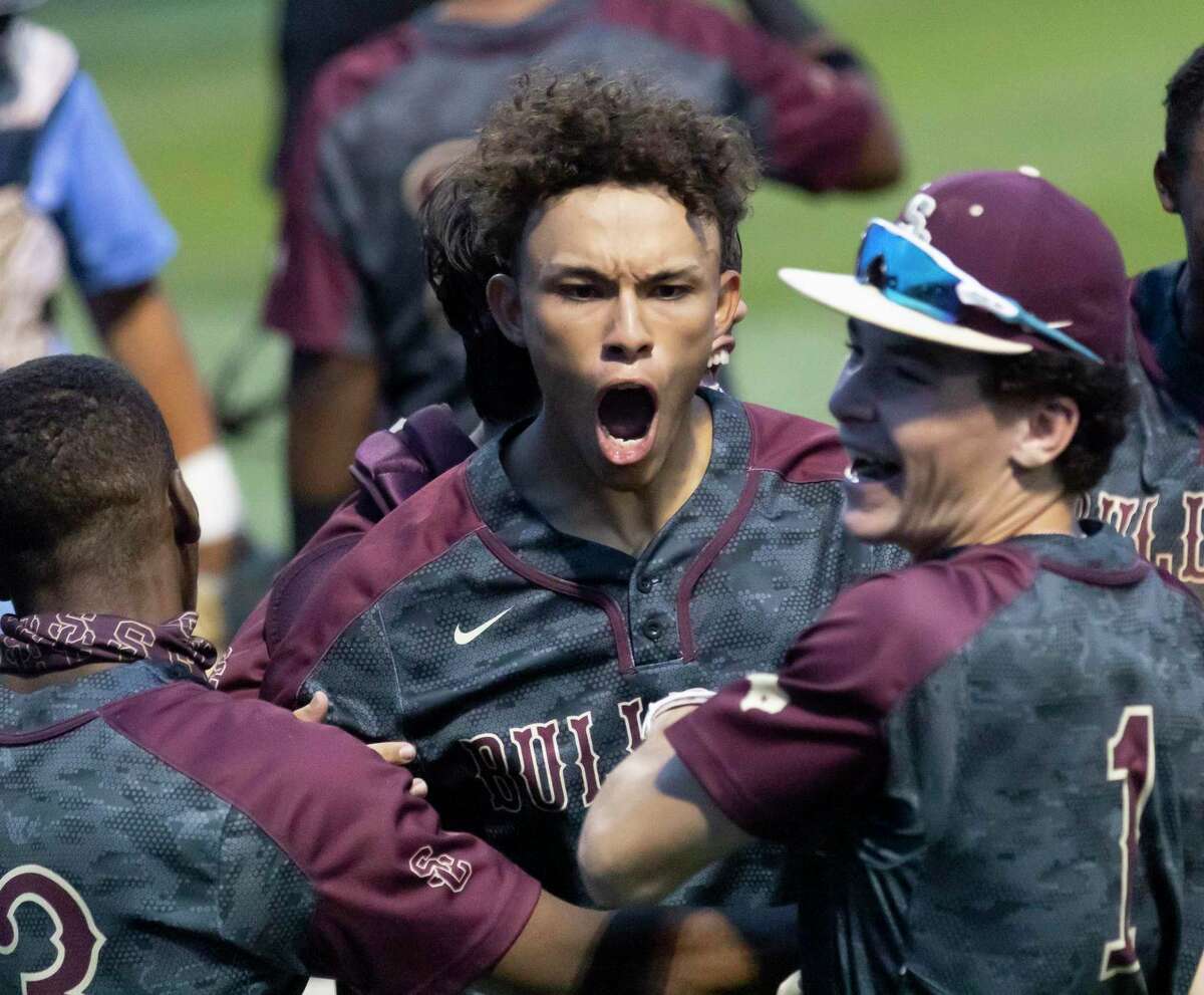 Diego Arcay #19 of Summer Creek reacts with teammates after hitting a home run during the third inning of a District 21-6A baseball game at Kingwood High School, Tuesday, April 27, 2021, in Kingwood.