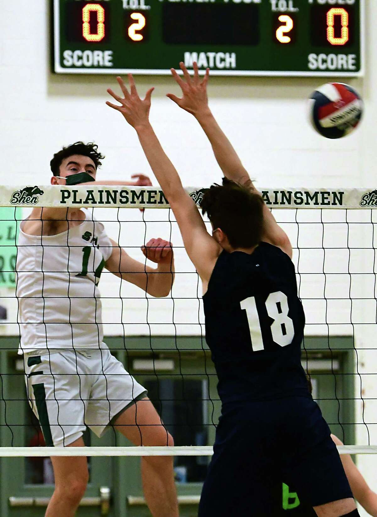 Shenendehowa’s Will Licata spikes the ball past Columbia’s Gabe Tucker during a volleyball game on Wednesday, April 28, 2021 in Clifton Park, N.Y. (Lori Van Buren/Times Union)