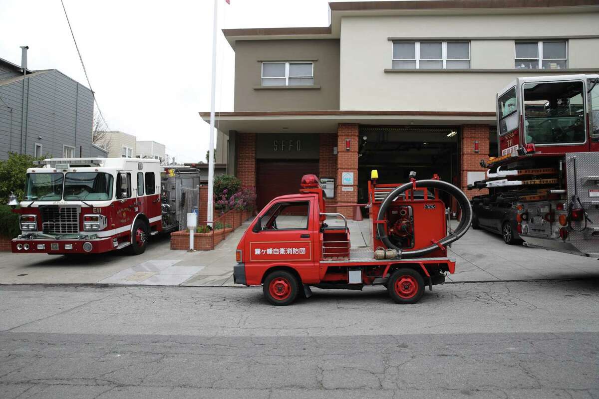 Todd Lappin, 53, parks his tiny fire truck in front of San Francisco Fire Department's Station 11. He shipped the vehicle from a Japanese mountain town to San Francisco last year.