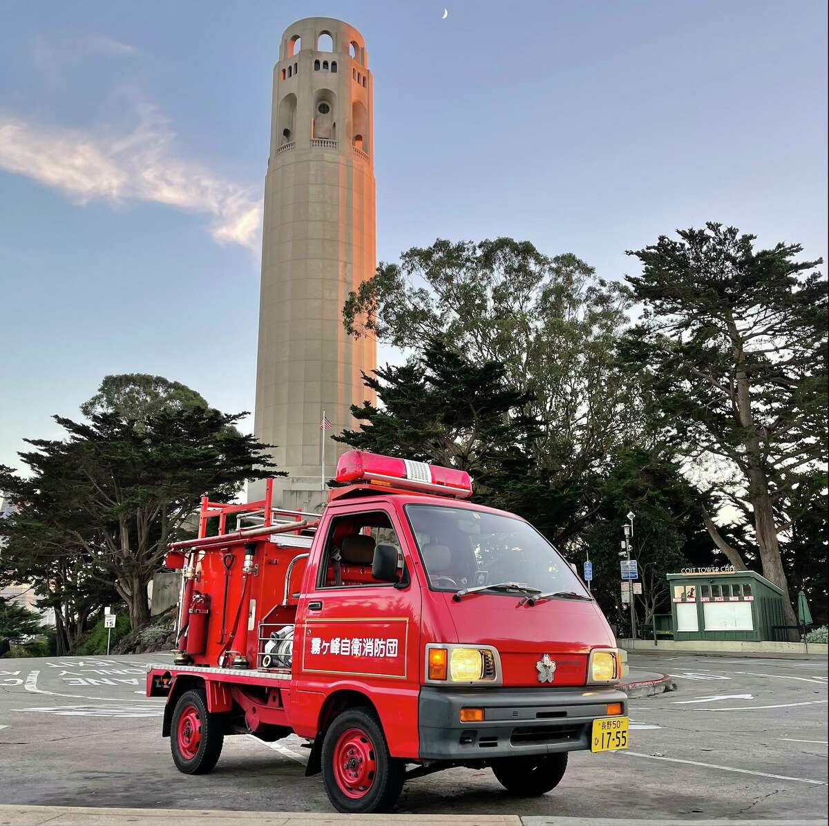 Kiri the tiny Japanese fire truck poses near Coit Tower in San Francisco. Kiri was bought at auction and has been touring the San Francisco Bay Area since July 2020.