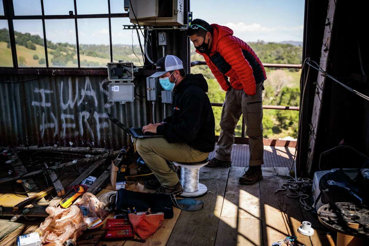 ALERTWildfire technicians work to install a camera at the Kennedy Gold Mine in Jackson, California on April 21.