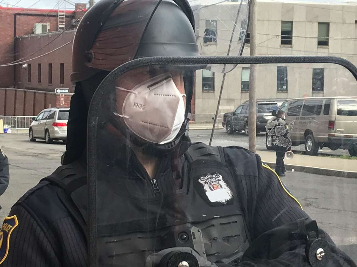 An Albany police officer with tape over his badge on April 22, 2021 at South Station. The city is expected to release an internal report of its investigation into why police officers covered their badges when the confronted protesters on Arch Street. The report was completed two months ago.