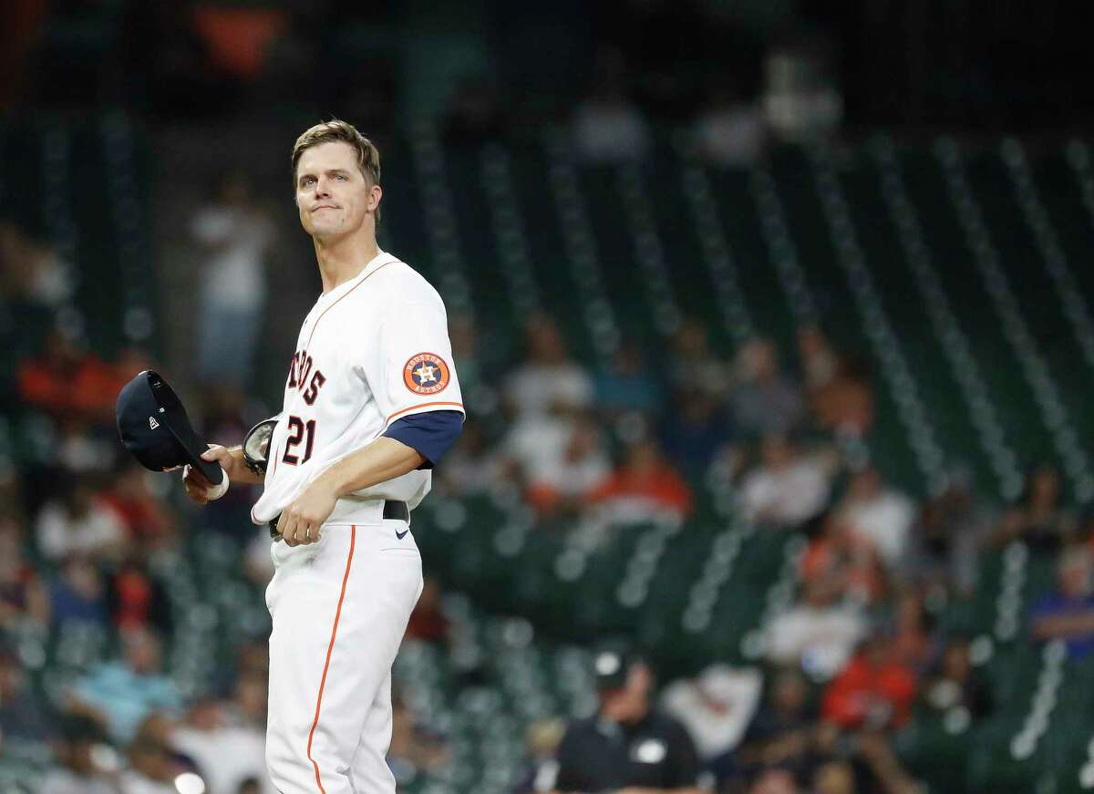 Houston Astros starting pitcher Zack Greinke (21) reacts after issuing a second walk in a row to Seattle Mariners Taylor Trammell during the fourth inning of an MLB baseball game at Minute Maid Park, Wednesday, April 28, 2021, in Houston.