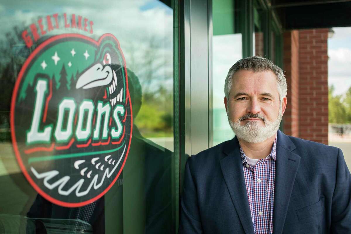 Great Lakes Loons President and General Manager Chris Mundhenk poses for a portrait Thursday, April 22, 2021 at Dow Diamond. (Katy Kildee/kkildee@mdn.net)