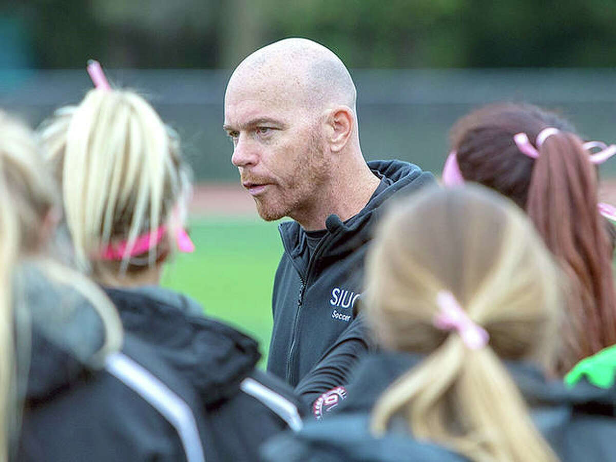 SIUE women’s soccer coach Derek Burton speaks with his team. The Cougars finished their season Wednesday night with a 3-1 loss to No. 12 Virginia in the first round of t he NCAA Tournament.