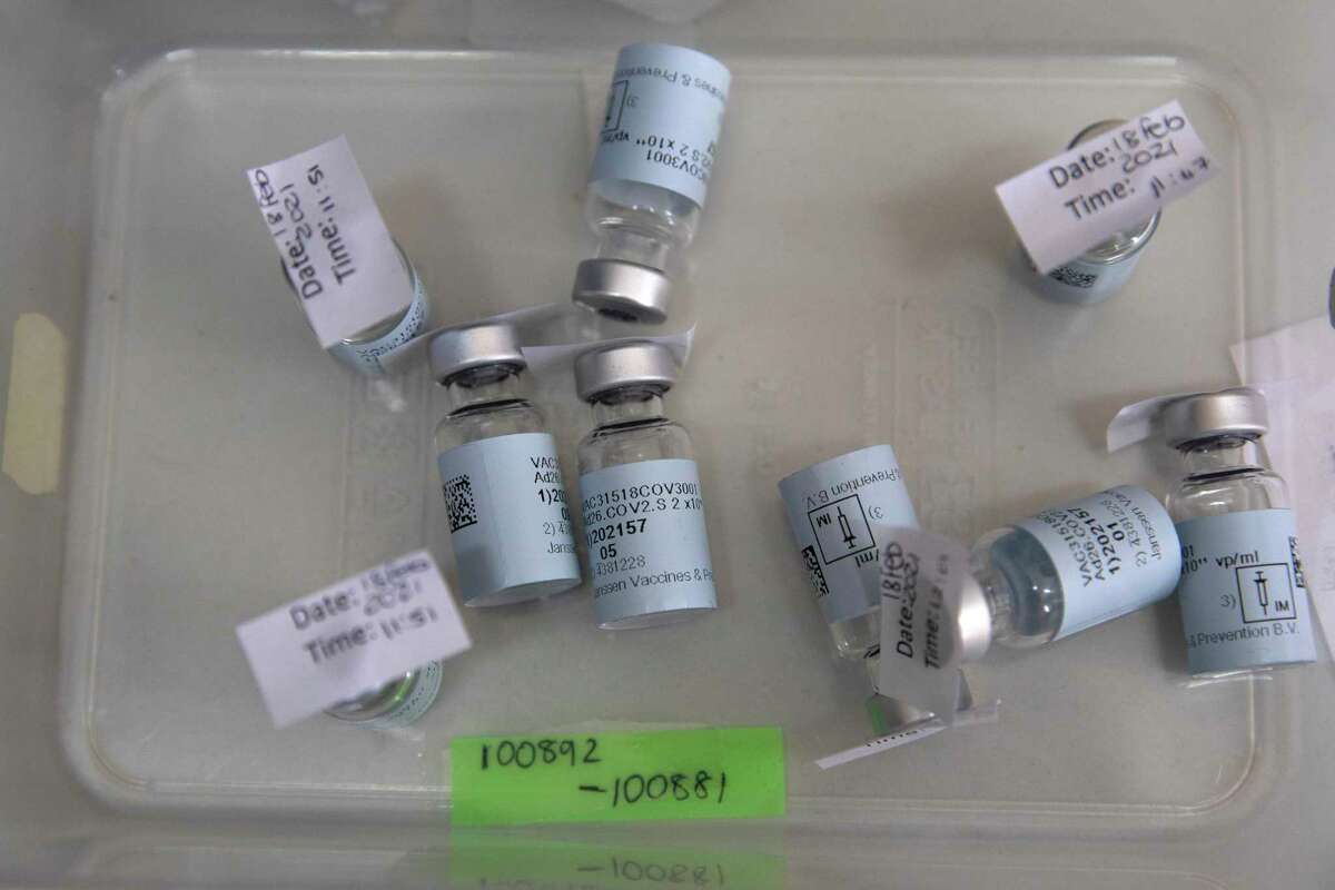 Empty vials that contained a dose of the Johnson & Johnson vaccine against the COVID-19 coronavirus lie on a table as South Africa proceeds with its inoculation campaign at the Klerksdorp Hospital on Feb. 18, 2021. (Phill Magakoe/AFP via Getty Images/TNS)