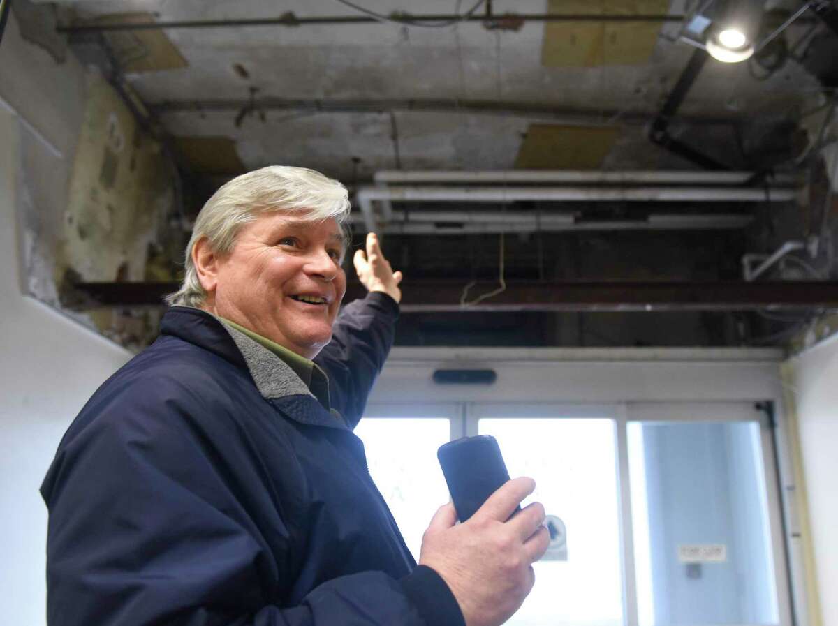 Town of Greenwich Superintendent of Building Construction & Maintenance Alan Monelli shows an entranceway that was stripped of an air conditioner to make way for a raised ceiling at the Senior Center in Greenwich, Conn. Wednesday, Feb. 26, 2020.