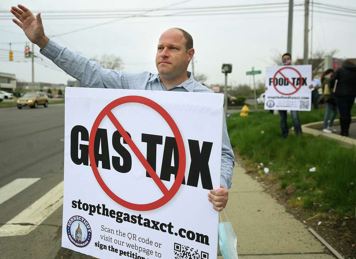 Patrick Sasser, of Stamford, founder of No Tolls CT, protests new gas and food taxes at a Stop the Gas Tax/Food Tax rally in Stratford, Conn. on Thursday, April 29, 2021.