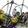 Children and familiies enjoy the carnival rides on the second night of the annual Port Neches RiverFest Thursday. Photo made Thursday, April 29, 2021 Kim Brent/The Enterprise