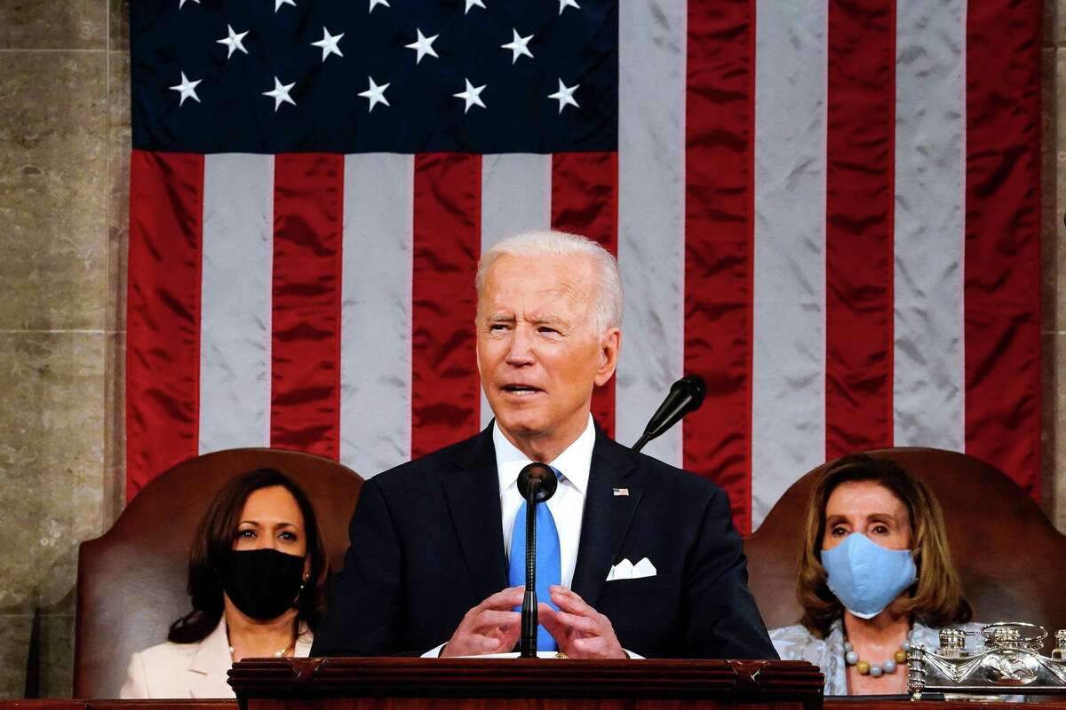 President Joe Biden, flanked by Vice President Kamala Harris, left, and Speaker of the House of Representatives Nancy Pelosi addresses a joint session of Congress at the U.S. Capitol in Washington, D.C., on Wednesday, April 28, 2021.